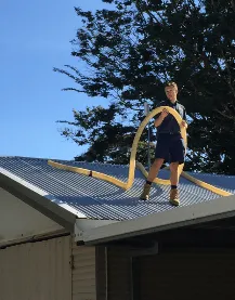 Plumber on roof in Gladstone