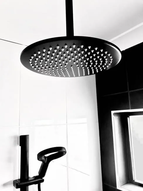 Black rain shower head installed in Gladstone bathroom