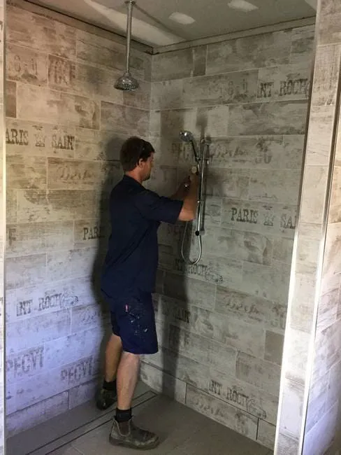Plumber installing shower in Gladstone