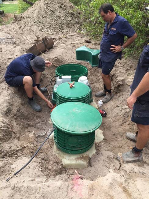 Gladstone plumbers installing septic tank in ground