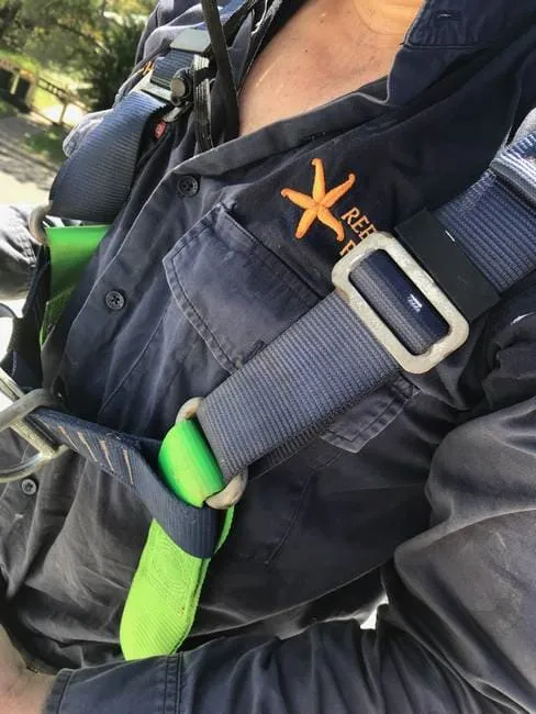 Michael in harness with Reef City Plumbing shirt